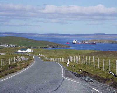 View into Ollaberry - a oil tanker makes it's way to Sullom Voe